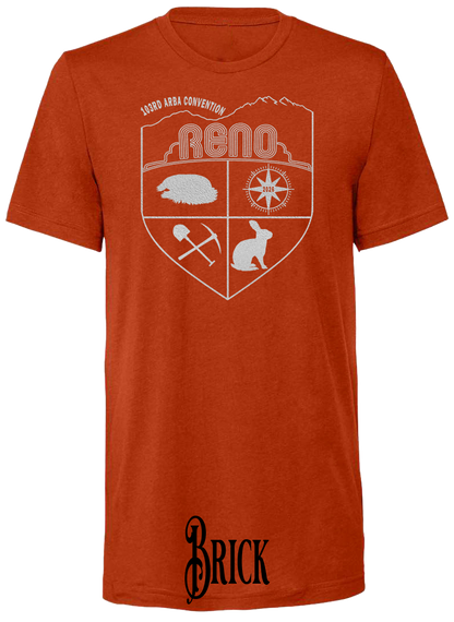 Brick triblend t-shirt with the Biggest Little Reunion crest in metallic silver - a rabbit, a cavy, a pick and shovel, and a compass under the Reno arch. 103rd ARBA Convention.