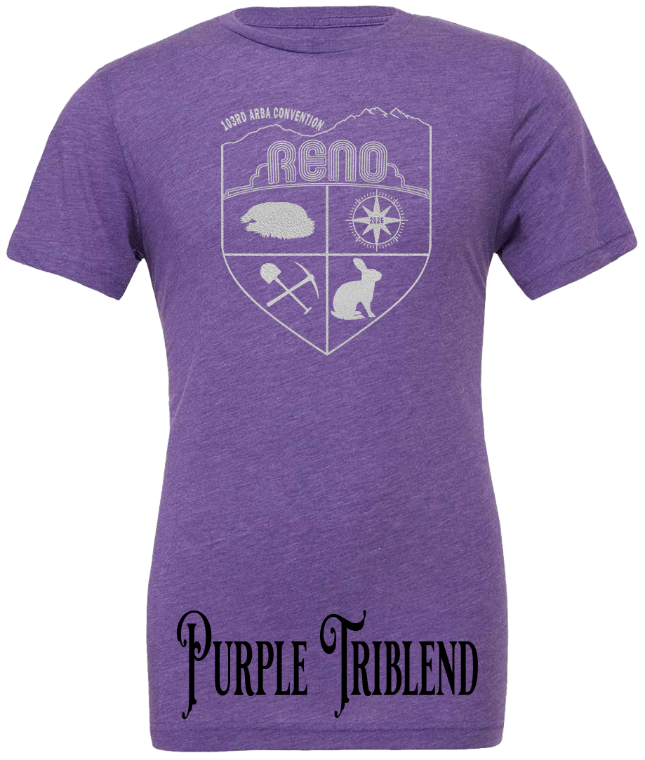Purple Triblend t-shirt with the Biggest Little Reunion crest in metallic silver - a rabbit, a cavy, a pick and shovel, and a compass under the Reno arch. 103rd ARBA Convention.