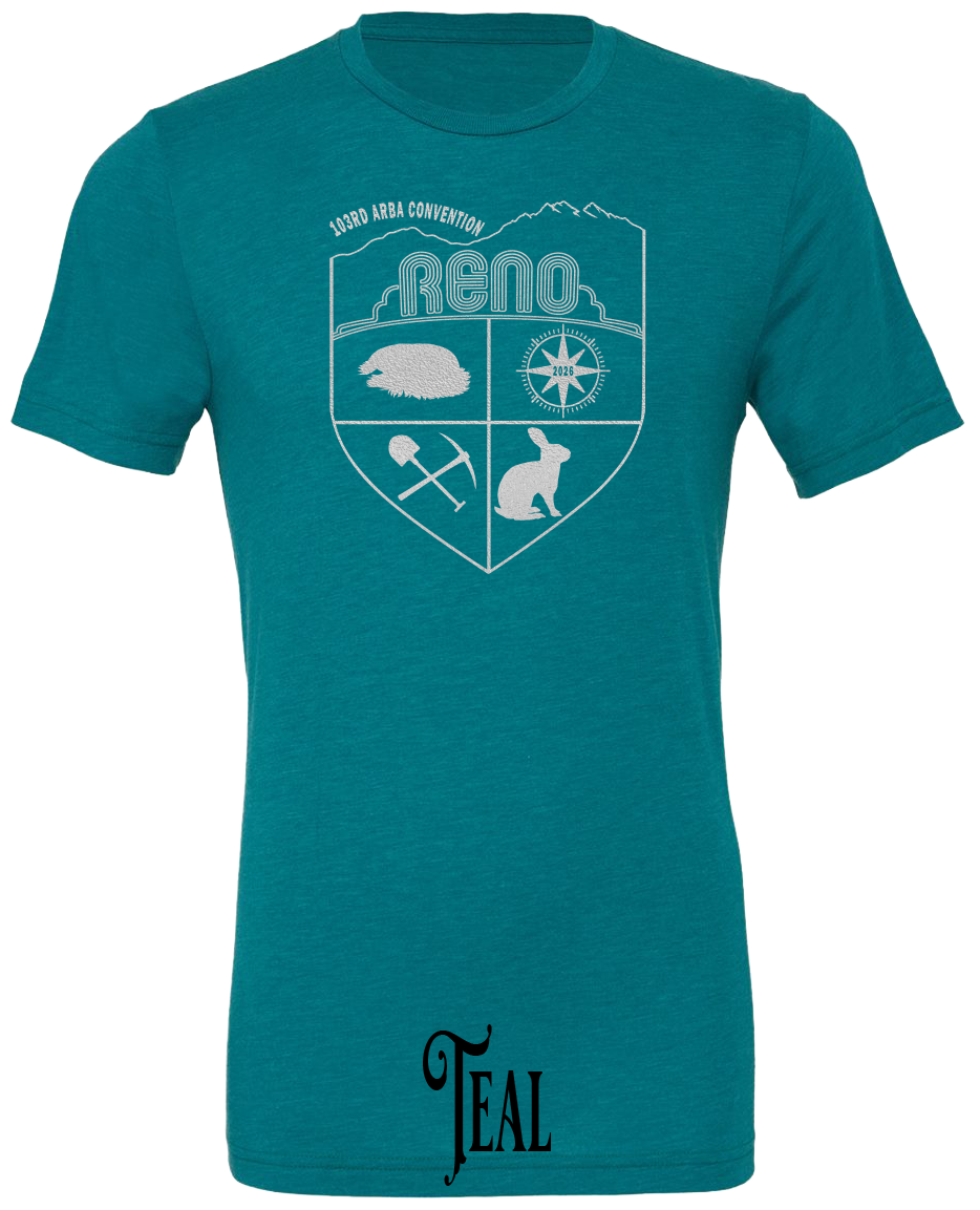 Teal triblend t-shirt with the Biggest Little Reunion crest in metallic silver - a rabbit, a cavy, a pick and shovel, and a compass under the Reno arch. 103rd ARBA Convention.