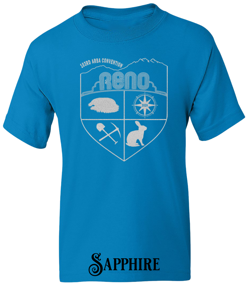 Sapphire youth t-shirt with the Biggest Little Reunion crest in metallic silver - a rabbit, a cavy, a pick and shovel, and a compass under the Reno arch. 103rd ARBA Convention.