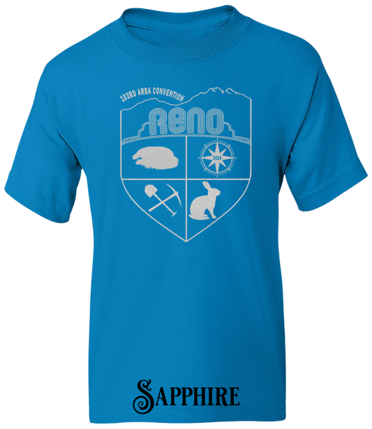 Sapphire youth t-shirt with the Biggest Little Reunion crest in metallic silver - a rabbit, a cavy, a pick and shovel, and a compass under the Reno arch. 103rd ARBA Convention.