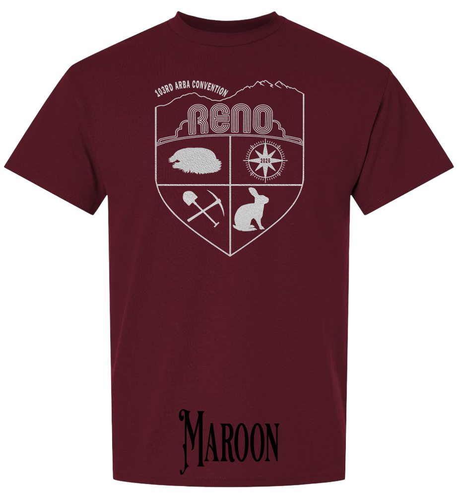 Maroon plus size t-shirt with the Biggest Little Reunion crest in metallic silver - a rabbit, a cavy, a pick and shovel, and a compass under the Reno arch. 103rd ARBA Convention.