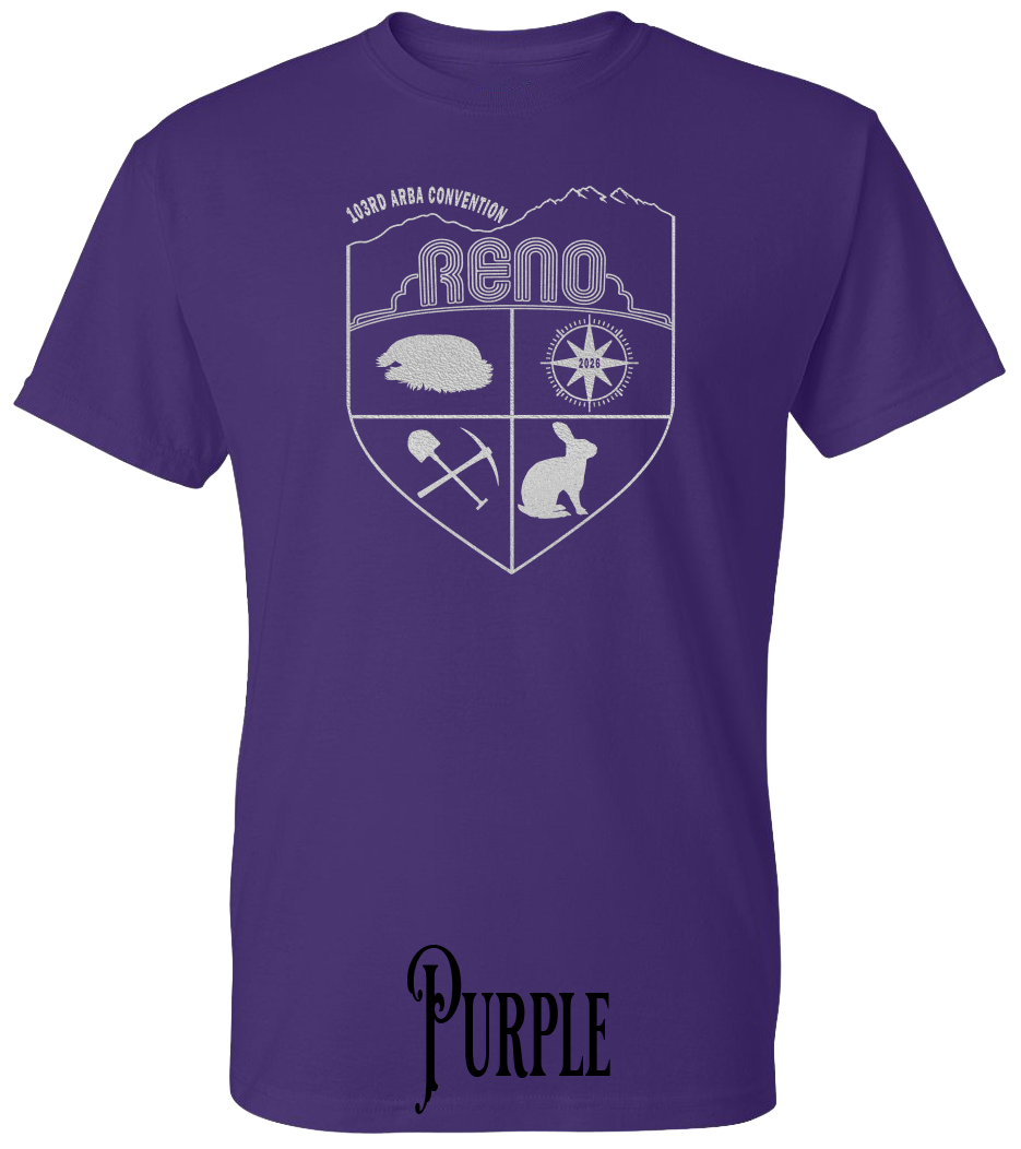 Purple plus size t-shirt with the Biggest Little Reunion crest in metallic silver - a rabbit, a cavy, a pick and shovel, and a compass under the Reno arch. 103rd ARBA Convention.